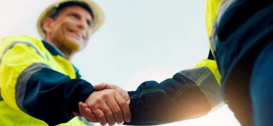 Consumers energy worker shaking hands with a business owner